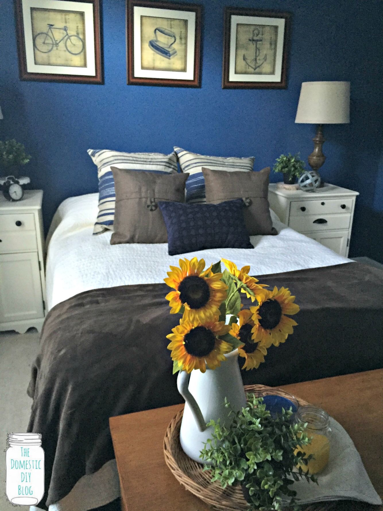 Navy Blue masculine Bedroom with white and brown bedding 